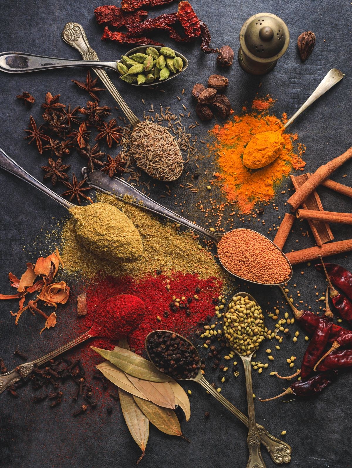 A table set with spices and a warm, inviting meal